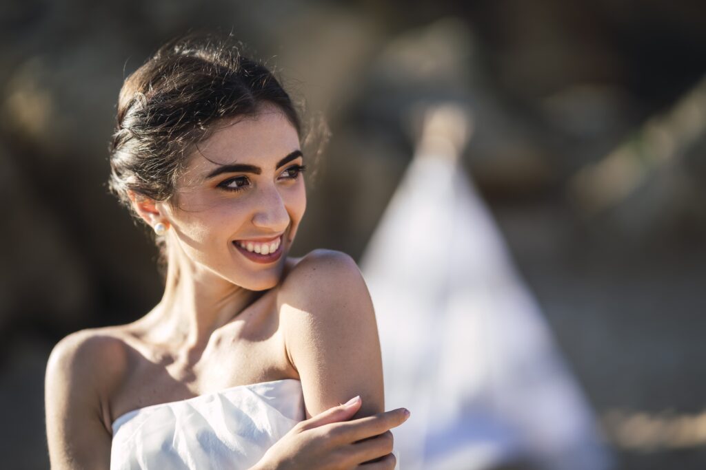 portrait of a brunette caucasian bride with a natural happy smile on her face
