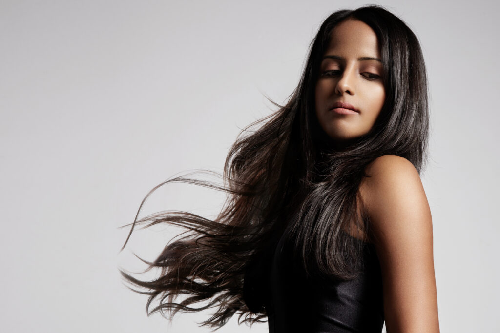 woman with healthy brunette hair in studio shoot